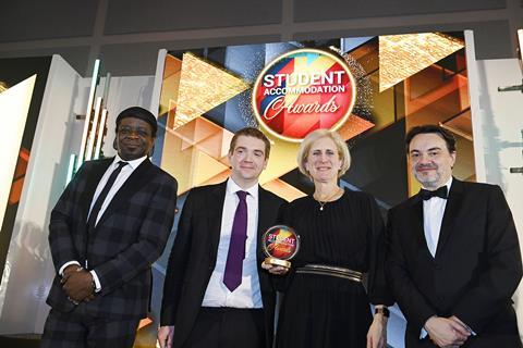 Victoria Goddard & Chris Owens pick up the Legal Team trophy for Pinsent Masons from Property Week editor Lem Bingley